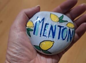 Souvenir of the city of Menton. Painted stone with citrus
