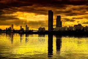 Golden hour view from a river to a big city
