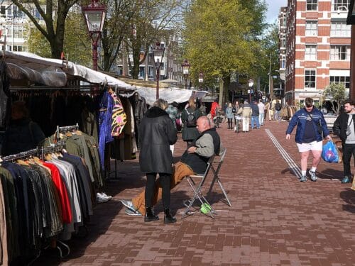 Waterloo plein market in Amsterdam. People enjoying the autumn sun and do some shopping