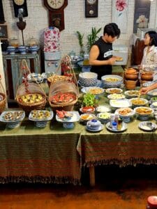 The breakfast table in Baanrak Homestay in Amphawa Thailand
