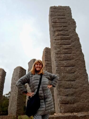 woman in front of the time and space statue in Ibiza