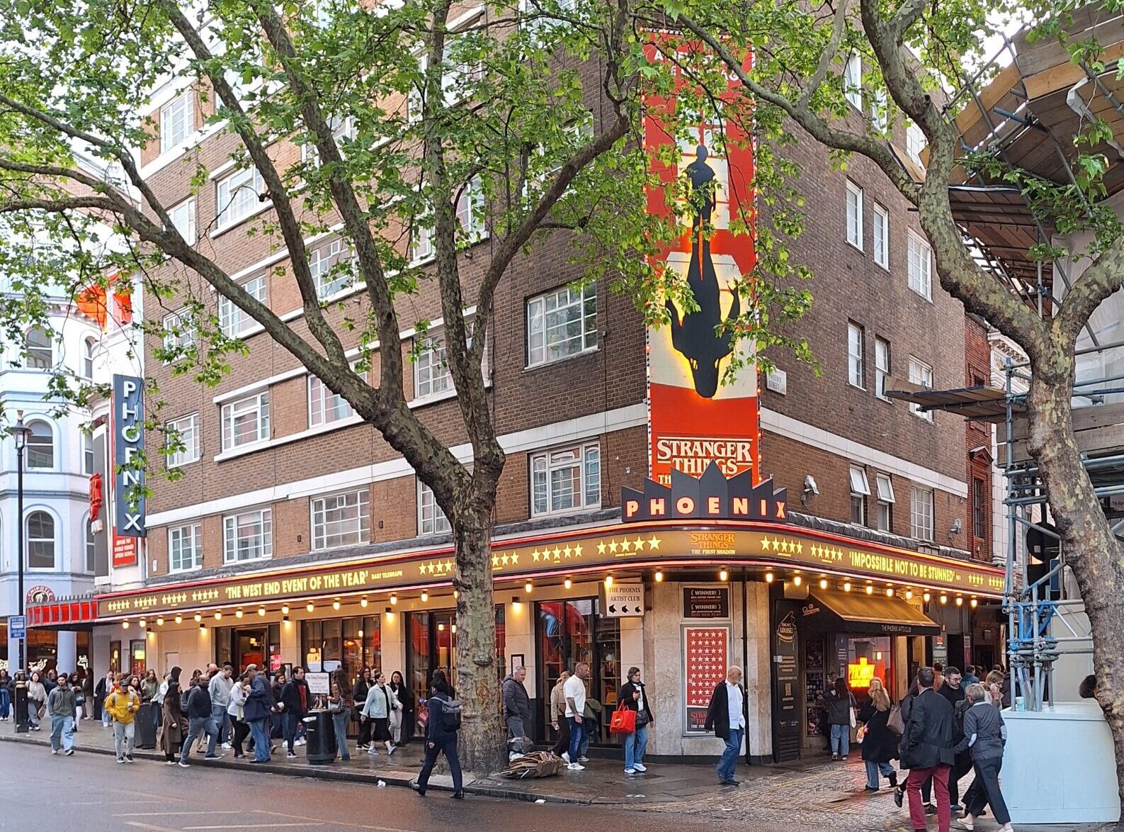 The Phoenix theatre building in London. With a sign of the show: Stranger things